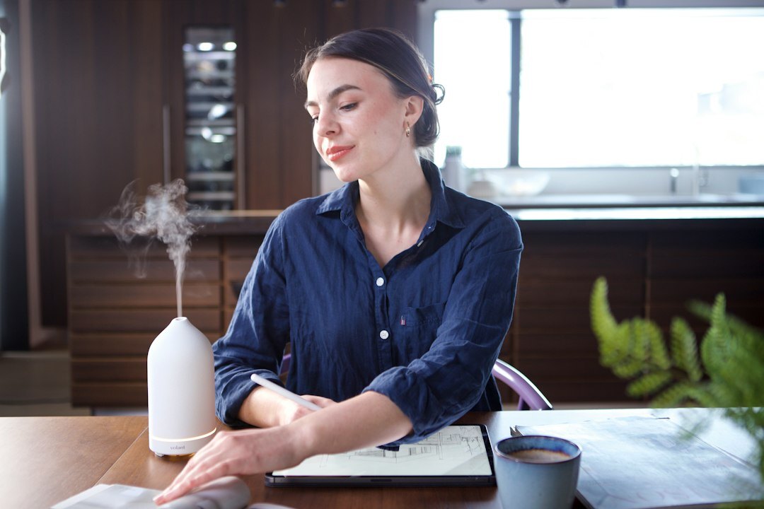 Singaporean businesswoman reviewing legal documents in a modern office